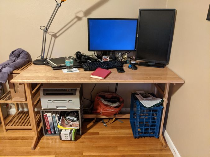 Desk with office equipement and other stuff on it, pardon the mess!